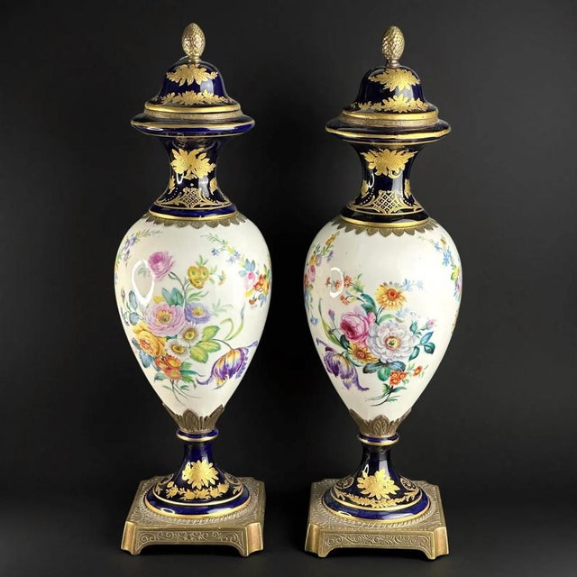 Magnificent pair of French porcelain vases in Sèvres style, dating to around 1900. Each vase features a cobalt blue...