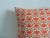 Orange printed pillow Poly insert Zipper closure Size: 18"H x 18"W