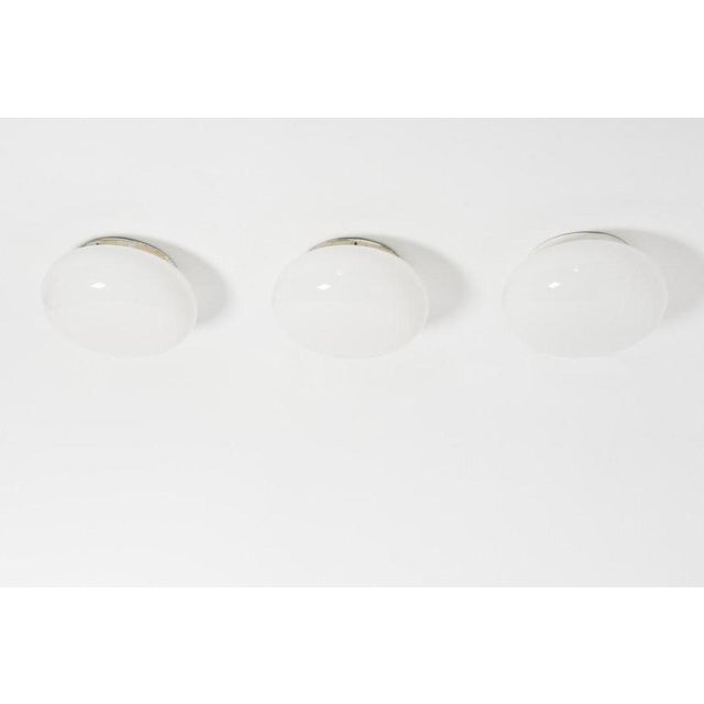 Beautiful Paavo Tynell wall/ceiling opaline glass lamps manufactured by Taito Oy, Finland in the late 1940s. Condition:...
