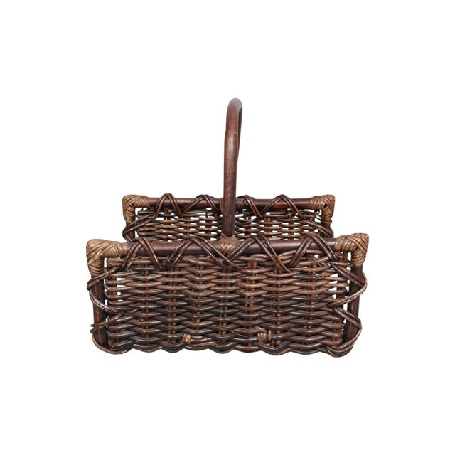A large French open ended log basket. Wicker woven rattan over a bamboo frame with high sides and a bent bamboo carrying...