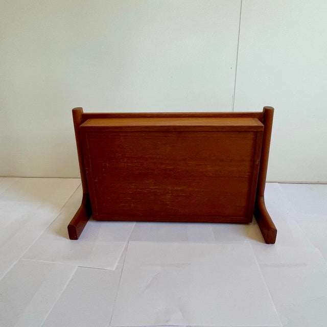 A vintage floating teak nightstand. These mid century wall mounted bedside tables were commonly produced in the 1950’s and...