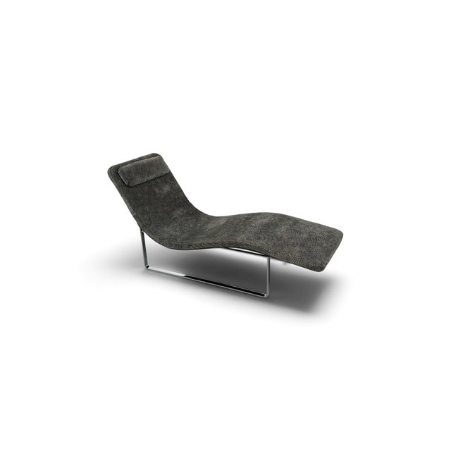 This sleek contemporary chaise lounge by B&B Italia, designed for the American market. Featuring a sculptural, gently...
