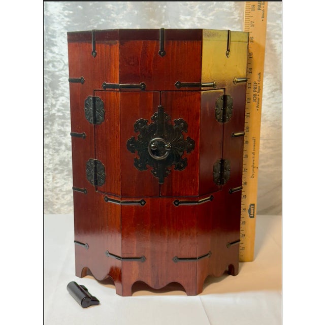 Vintage Korean Octagonal Wooden Cabinet With Merlot Finish, Black Hardware & Lock This vintage Korean 'Hat Box', as some...