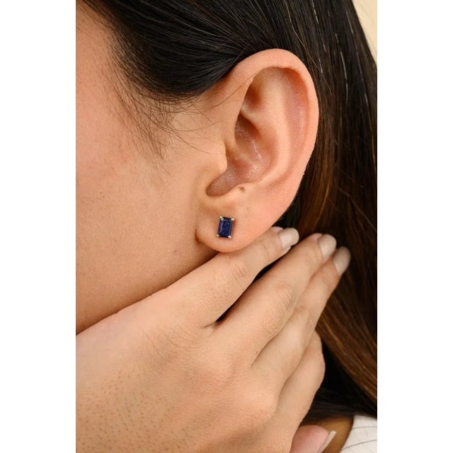 This is part of Chairish’s Fine Jewelry assortment. Baguette Deep Blue Sapphire Everyday Stud Earrings for Her in 14K Gold...