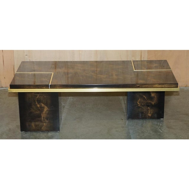 Lovely Mid Century Modern coffee table with hidden internal storage and hand painted and lacquered finish. Dimensions...