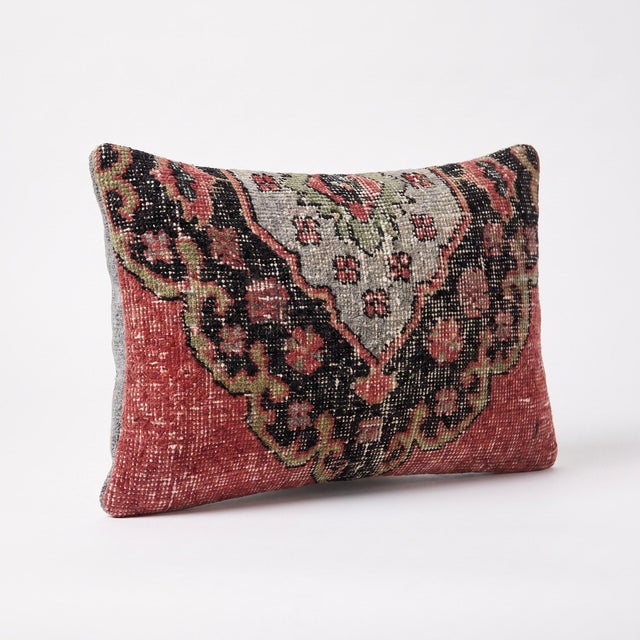 This beautiful 12'' x 19'' pillow cover was made from an authentic Turkish rug. Bright colors of wool adorn the front of...
