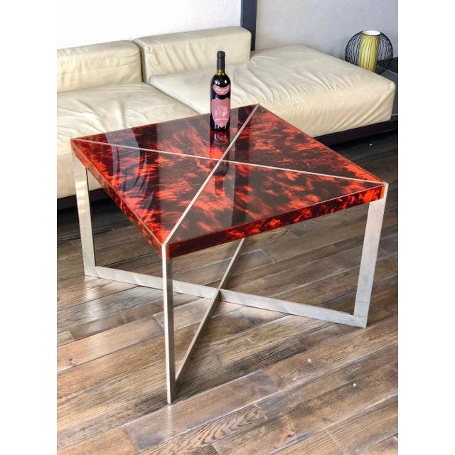 Squared Mid-Century table made of a tortoiseshell acrylic surface and a chrome "X" structure. Italy circa 1970.