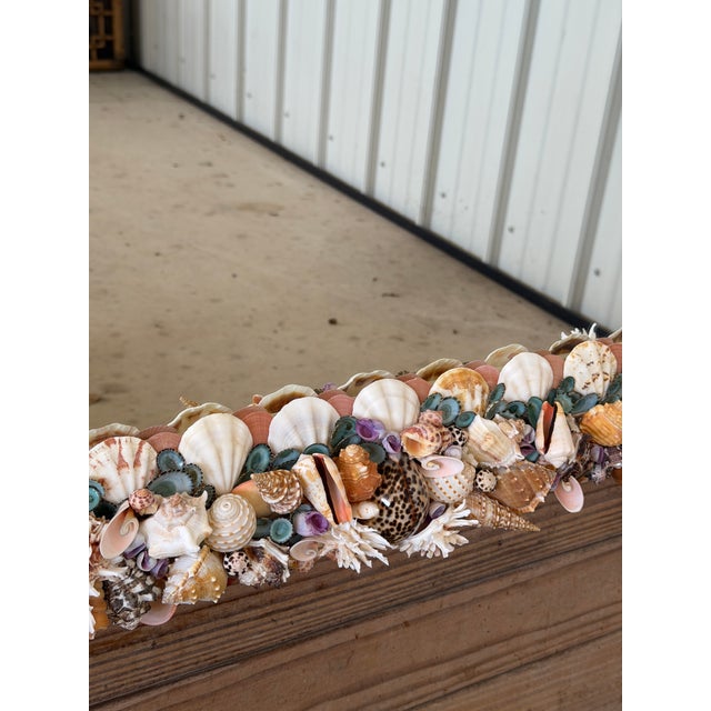 Absolutely stunning custom coastal seashell wall mirror featuring an incredibly detailed handcrafted frame adorned with an...