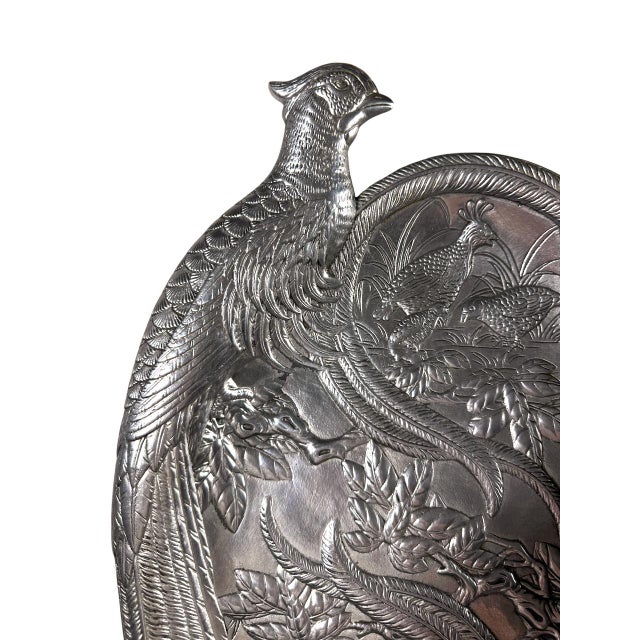 A 1986 cast aluminum serving platter from Arthur Court's game bird line, shaped as a pheasant with a sculpted head rising...