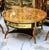 Elevate your living room with this exceptional French Louis XV-inspired coffee table, featuring an elegant oval...