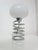 Beautiful Spring table lamp by Ingo Maurer for Honsel. Germany, 1970s. Spiral tubular structure in chromed metal. Round,...