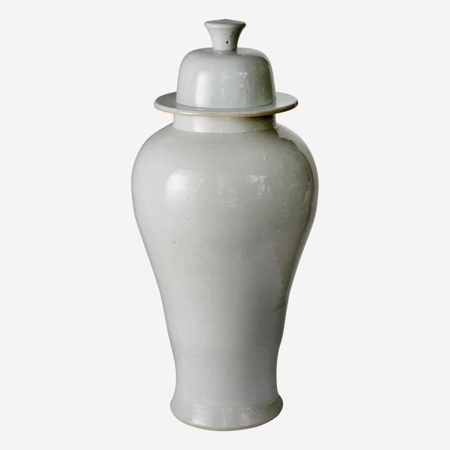 Just in, This elegant and commanding pair of monochrome white porcelain temple lidded jars (also classified as baluster or...