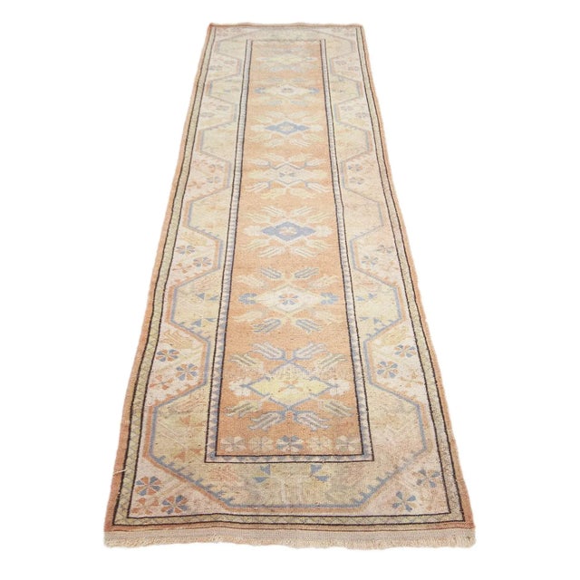 Vintage handknotted decorative runner rug from Milas region of Turkey. Approximately 50-60 years old. In very good condition.