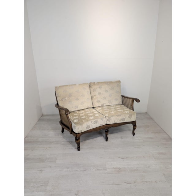 Stylish Louis sofa with woven sides This elegant sofa features a classic style, crafted on a solid, dark brown wooden...