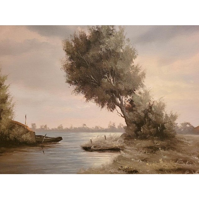 This atmospheric 1930s Dutch river landscape oil painting, signed W. Kroon, beautifully captures the serene character of...