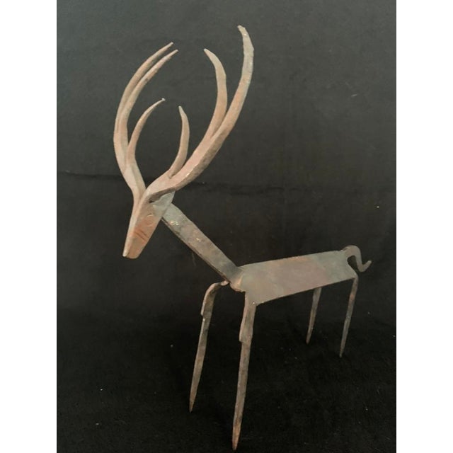 A striking hand-forged wrought iron deer sculpture. Purchased in 2006, this piece beautifully showcases the late-1990s and...