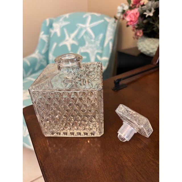 Charming and compact, this vintage square-form glass decanter features an eye-catching all-over diamond point pattern that...