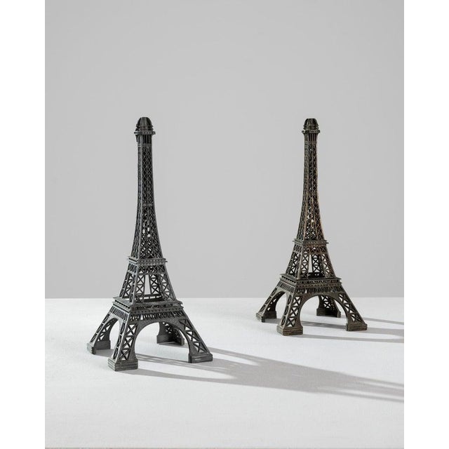 This pair of brass decorations in the shape of the Eiffel tower conjures the romance of a voyage to Paris. Made in France...