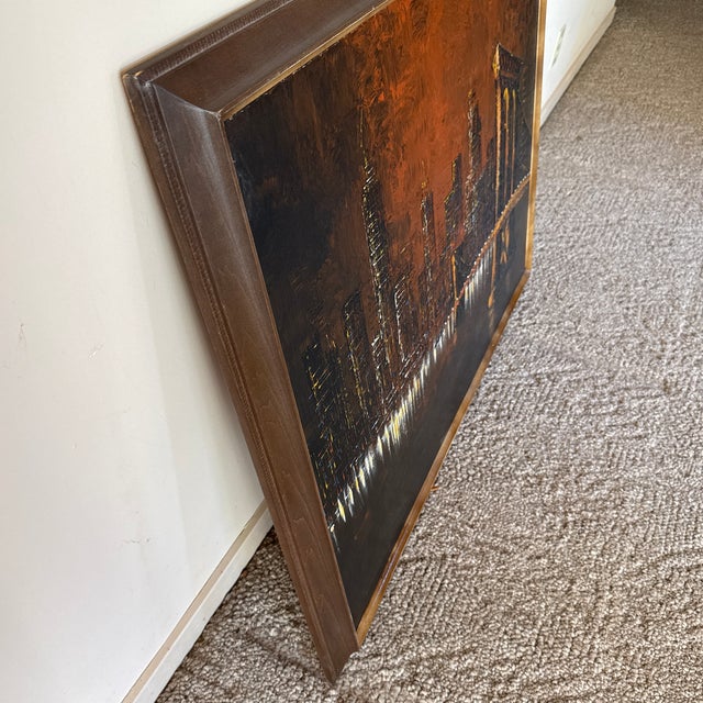 Add dramatic mid-century modern flair to your space with this striking, oversized vintage cityscape painting signed by...