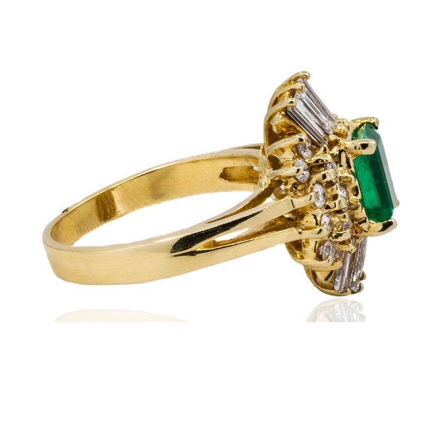 14k Ring with 1.32 carat Colombian emerald and 1.11 carats of round and baguette cut diamonds 7.24 grams