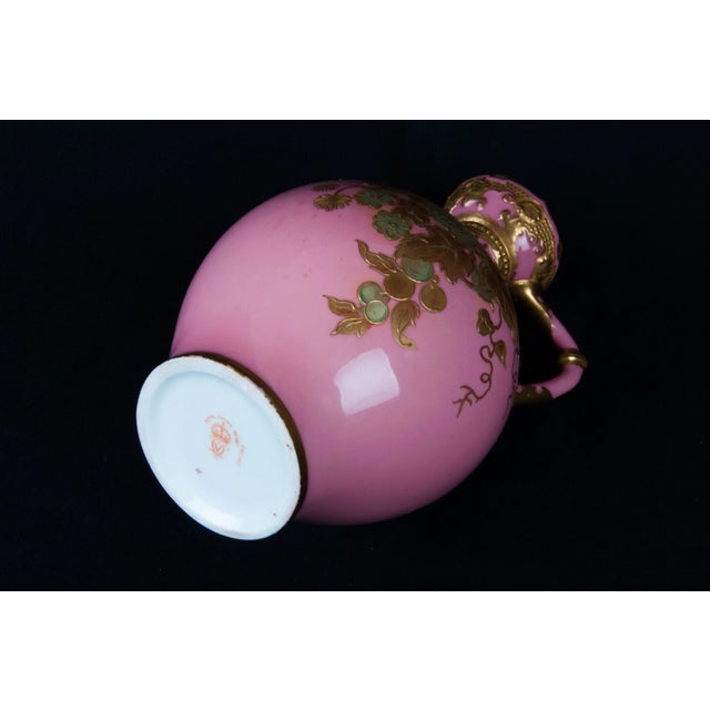 Crown Derby porcelain pink ground ewer with 22kt gilded leaves and blossoms. Hand Painted. Marked "Royal Crown Derby...
