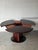 Featuring an iconic circular design, this table expands effortlessly with its patented clever butterfly extension...