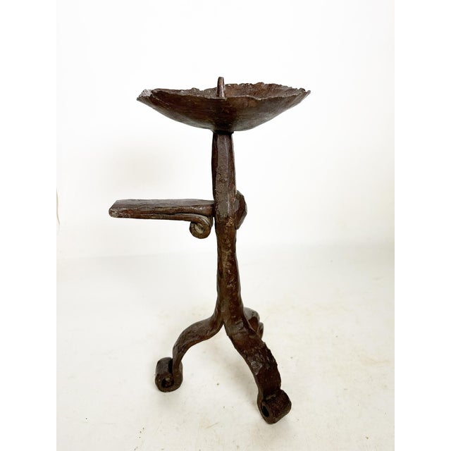 French cast iron workshop candlestick, made in France in the 1950s. This sculptural piece in raw cast iron features a...