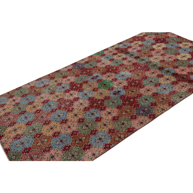 This vintage 5x9 Art Deco rug, hand-knotted in wool, circa 1960-1970, features a mid-century take on Art Deco...