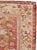 This early 20th century Turkish Oushak throw rug, measuring 2' 10" x 5' 6", showcases a graceful column of stylized floral...