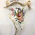 A delightful cornucopia-shaped Faience wall decoration signed Angoulême, a flower holder wall pocket in ivory white tin-...