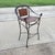 Iron Horseshoe Back and Leather Chairs in an antique brown finish. Seats and arm rests arm are in woven webbed design. Arm...