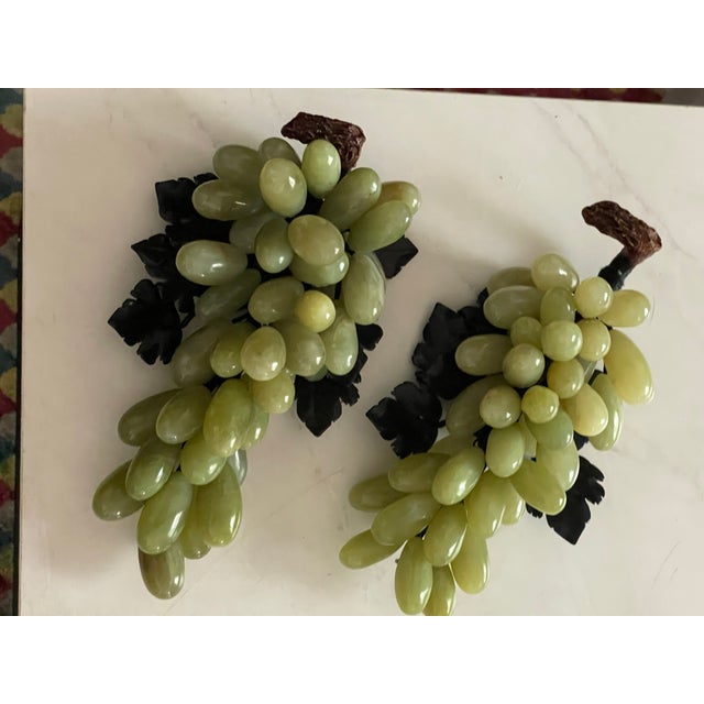 Large and heavy sumptuous Chinese vintage pair of grapes sculptures in spinach jade leaves and jadeite fruits. Impressive.