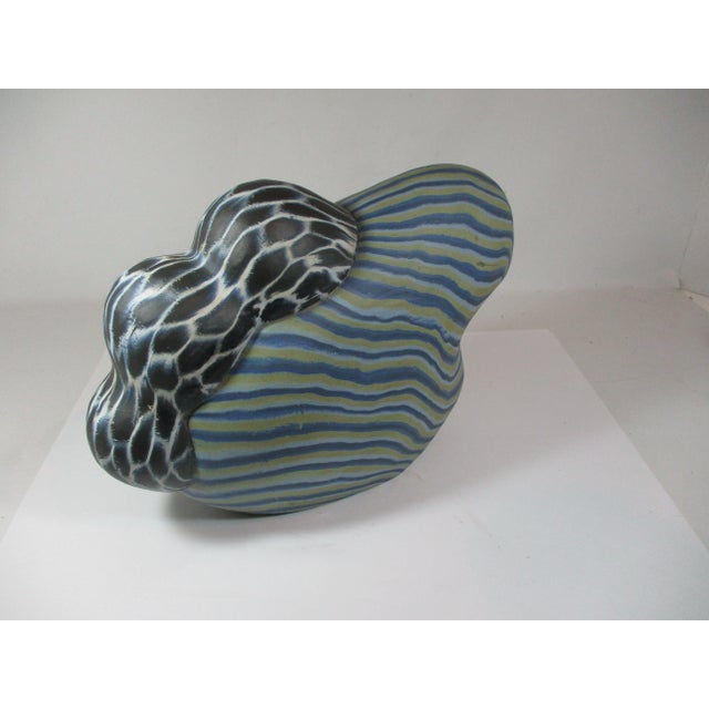 Abstract hand made contemporary pottery organic sculpture. This piece has a hand painted body decorated with a ombre...