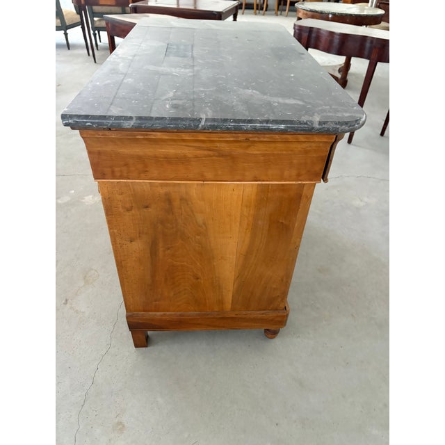 A handsome 19th-century French walnut buffet, circa 1840–1860, with beautifully figured paneled doors and a substantial...