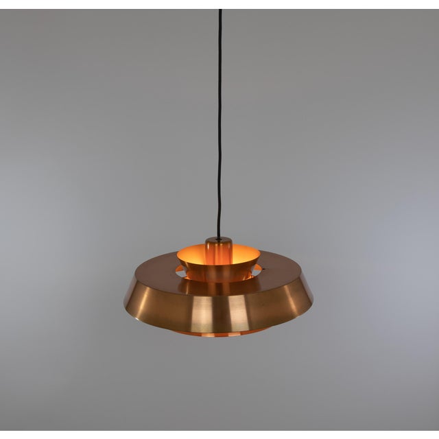 Copper Nova pendant, designed by Jo Hammerborg, who was the main designer of Danish lighting manufacturer Fog & Mørup in...