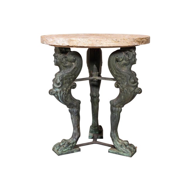 Hellenistic-style Greco-Roman cast bronze round table. Monopodial paw-footed sphinx support. New stone top.
