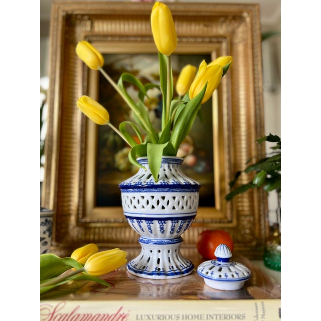 Vintage, blue and white ginger jar, with reticulated detail. Porcelain ginger jar was made by Bombay Co. Dimensions: H-...