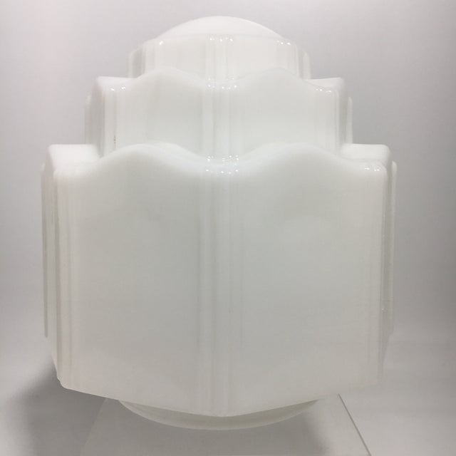 1930s Art Deco milk glass shade with stepped design. 6" x 6" x 6.25" (overall) 3.75” (opening) 0.26