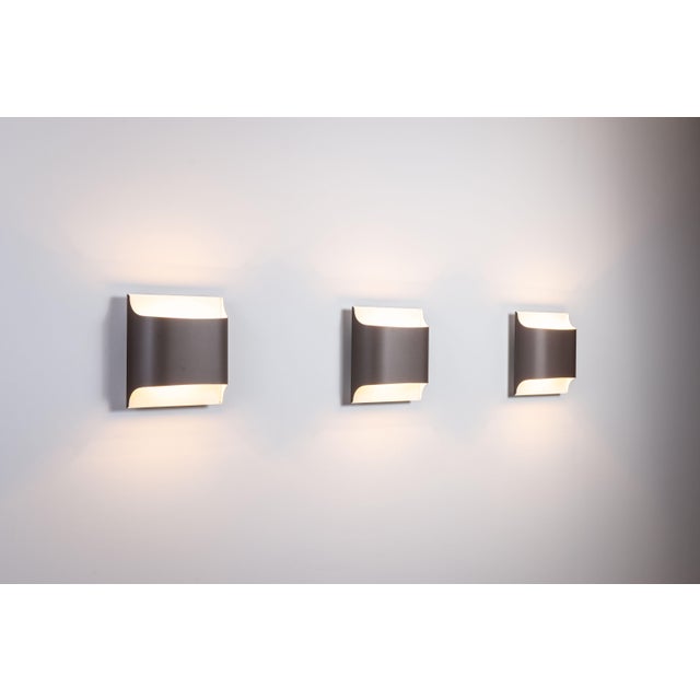 This large set of six Model 2030/31 wall lamps by Rolf Krüger and Dieter Witte for Staff Leuchten captures the essence of...
