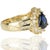 18kt Yellow Gold ring containing one pear shape sapphire weighing 1.55 carats and 26 round diamonds weighing 0.95 carats...