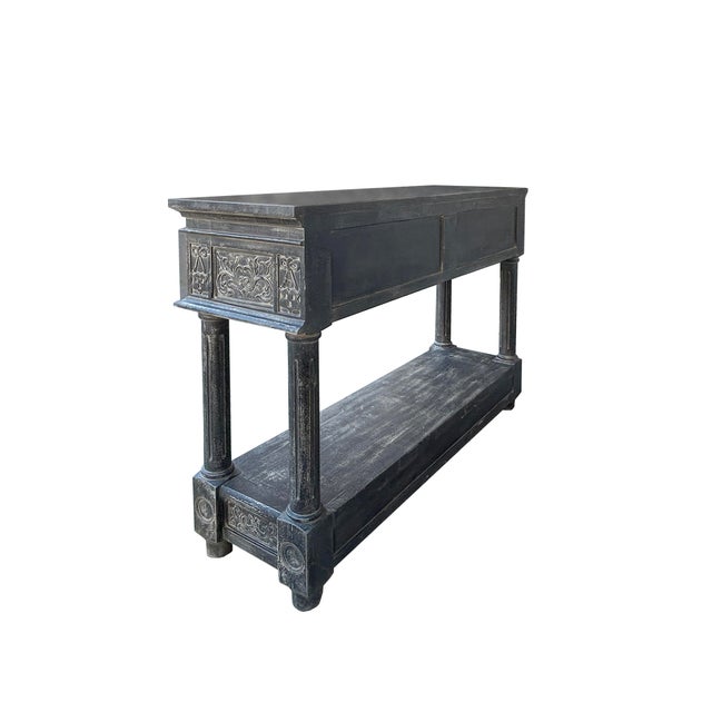 This Distressed Black Gray Relief Floral Motif Tall Credenza Console Cabinet is a striking and versatile piece of...