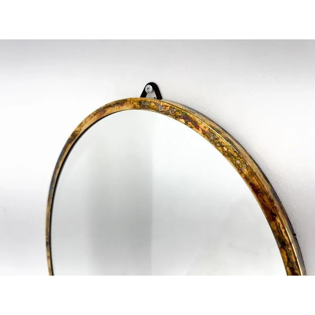 Wall mirror with facet in brass frame. Made in France in the 1950s.