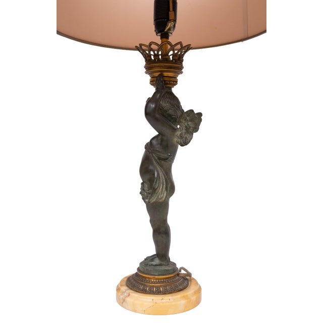 Stunning Bronze Cherub candelabra table lamp . Marble base . Beathiful Patine . comes complete with Light Pink color Silk...