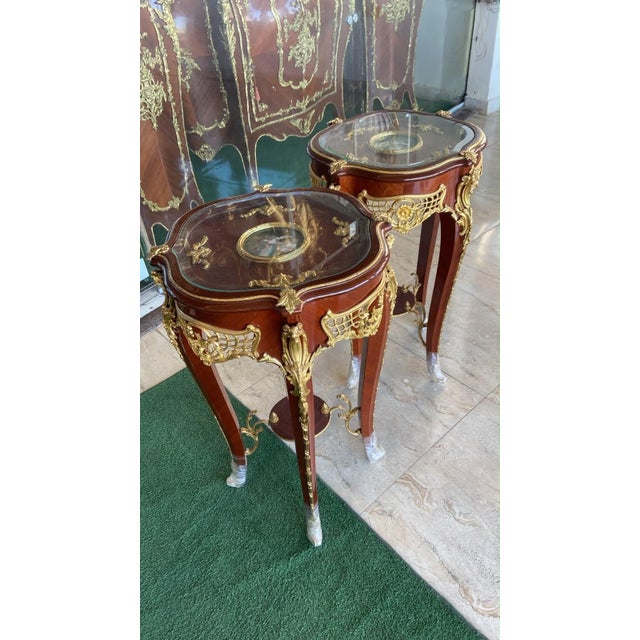 Elevate your interior with this magnificent pair of French Louis XV side tables, handcrafted from solid mahogany and...