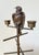 An exquisite 19th century bronze parakeet with a hinged head that can hold matches or ink. A stand with various perches...