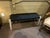 Sleek vintage wood bench with a woven cord seat, combining natural materials with clean minimalist design. The light wood...