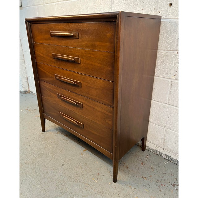 A standout piece from Broyhill's celebrated Emphasis collection, this Mid-Century Modern highboy dresser showcases the...