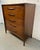 A standout piece from Broyhill's celebrated Emphasis collection, this Mid-Century Modern highboy dresser showcases the...