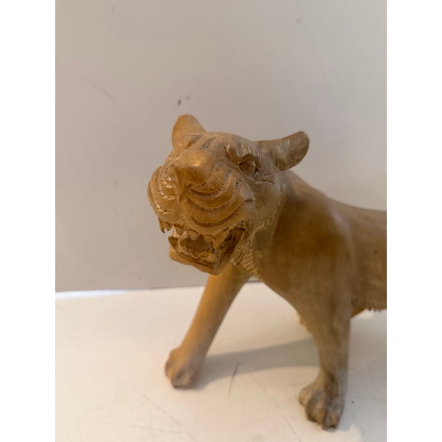 Vintage 1980s hand-carved wood cat sculpture, a unique animal figurine featuring detailed craftsmanship and a warm natural...