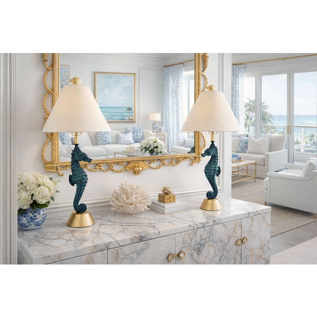 Offering a restored pair of vintage Seahorse Lamps with newly gold leaf hardware and bases, circa 1960s. The seahorse...